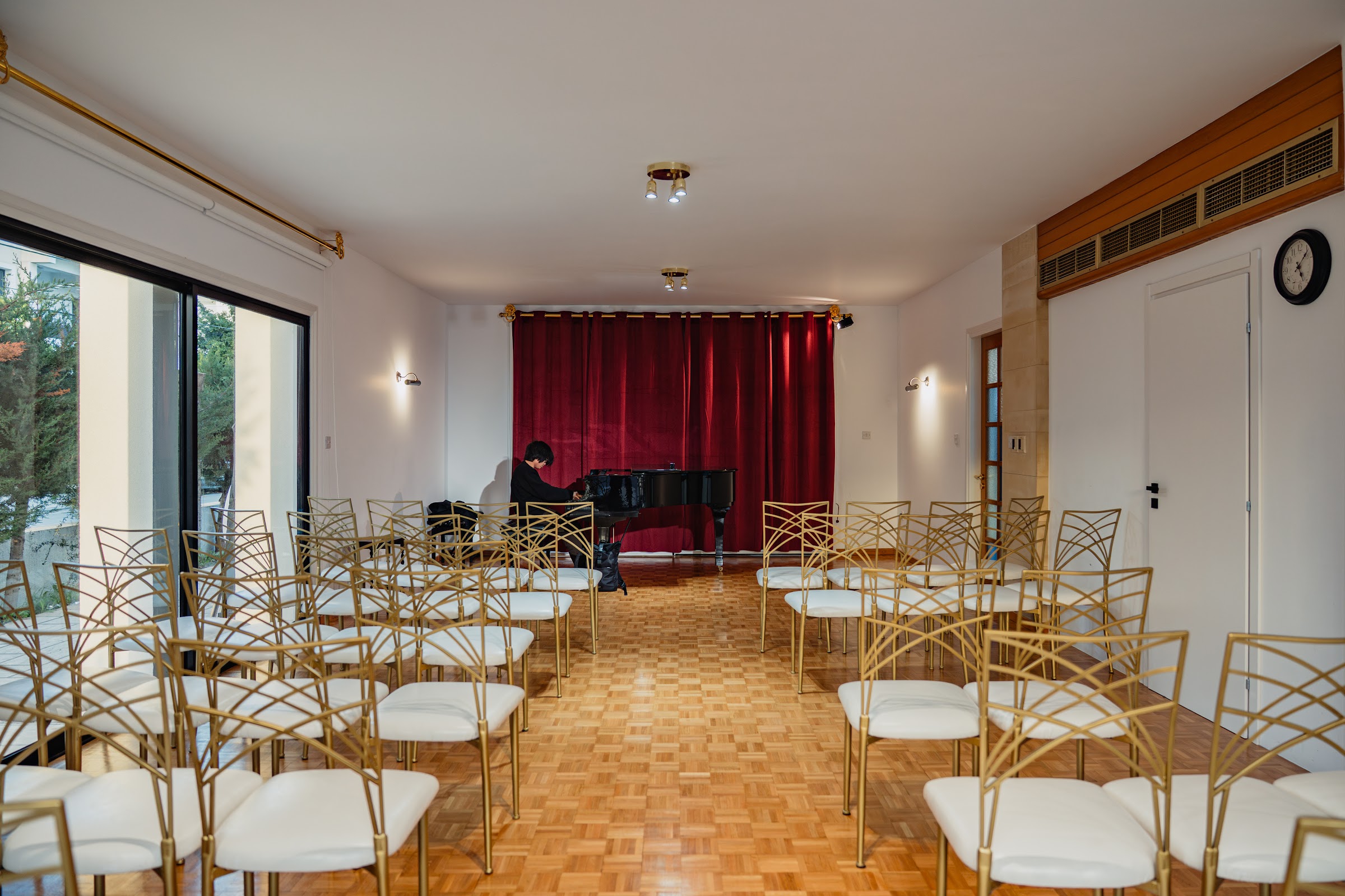 A student performing at the Yamaha grand piano during a masterclass